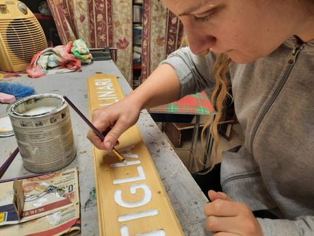 Crafting a wooden sign: painting the letters