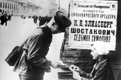 A Soviet soldier buys a ticket for the  performance of the Seventh Symphony in Leningrad in August 1942