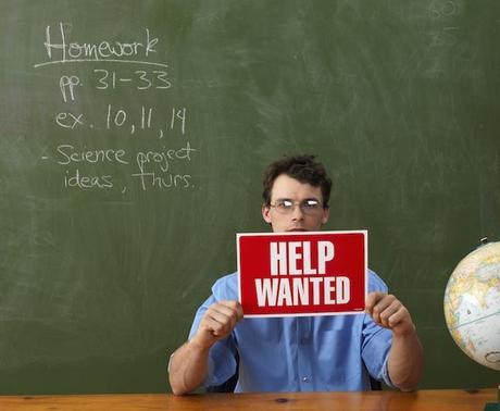 Teacher with Help Wanted Sign