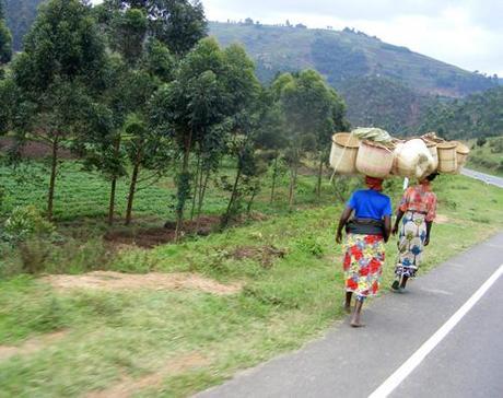 Local women carrying handwoven baskets near Kisoro