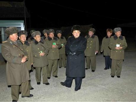 Kim Jong Un and senior members of the Korean People's Army high command attend nught jump exercises by KPA airborne service members (Photo: Rodong Sinmun).