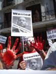 Spanish protester in July 2010 in Madrid showing Kagame's blood hands. At that occasion, Spanish prime minister Sapatero refused to be seen in public with Paul Kagame who was attending a UN metting on MDGs. 