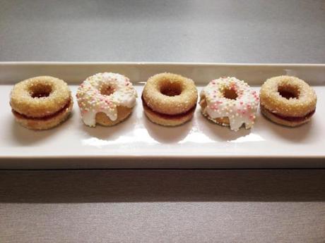 mini ring doughnuts jam sandwich and white iced with sugar sprinkles quick bake ideas