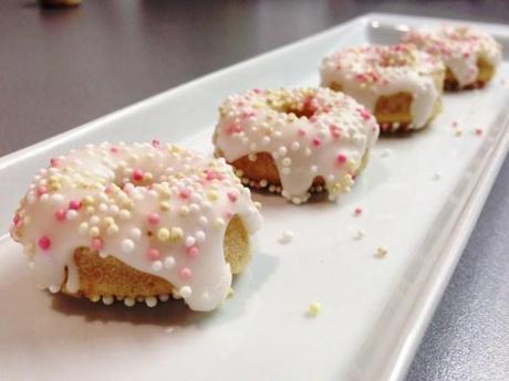 mini ring doughnuts with white icing and pink sugar sprinkles easy home bake quick recipe