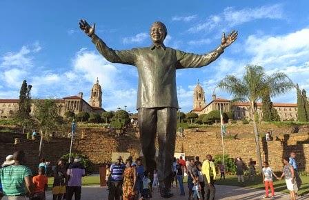 tall Mandela statue and the bunny inside its ears....