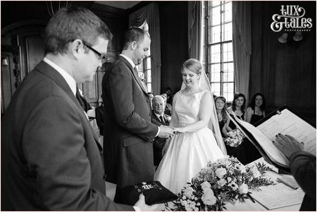 Bride and groom exchange rings at wedding at Credar Court Grand Hotel in York