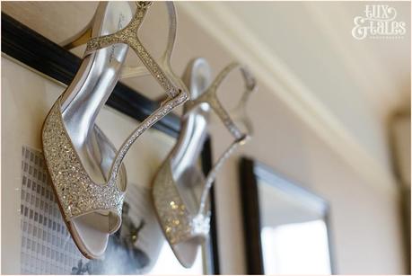 Shoes hanging from picture at wedding at Cedar Court Grand Hotel