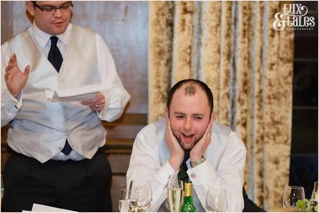 Groom covers his ears during best man speech at Cedar Court Grand Hotel Wedding