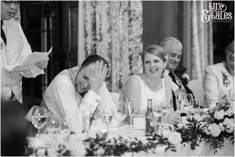 Groom hides his face during best man speech