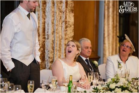 Speeches at York wedding and the bride is laughing and smiling