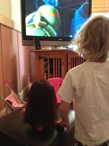 Dora and Julia watching the Teenage Mutant Ninja Turtles