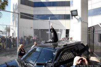 Justin Bieber Riding Away From The Police Station On Top Of His Escalade After His Arrest Is BAWSE.
