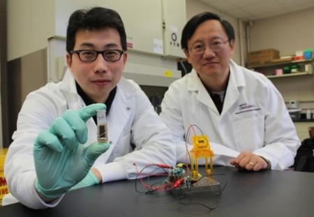 Y.H. Percival Zhang, right, an associate professor of biological systems engineering in the College of Agriculture and Life Sciences and College of Engineering at Virginia Tech and Zhiguang Zhu, who received his degree in biological systems engineering in 2013, show their new sugar battery, which has an energy density an order of magnitude higher than others.