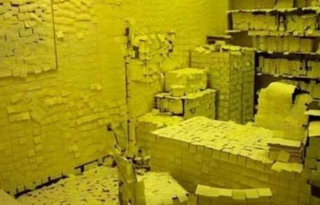 Office covered in Post-it notes for a prank