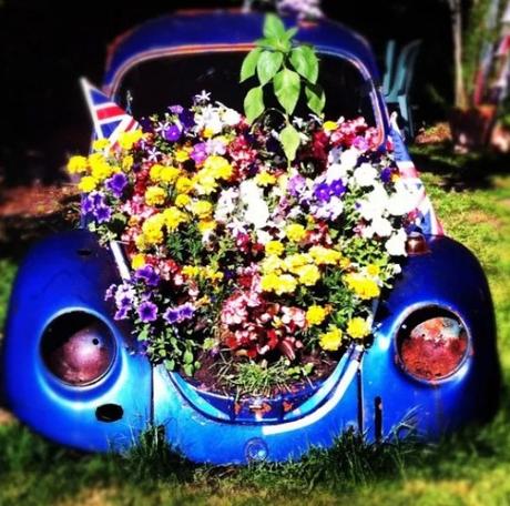 Blue Volkswagen Beetle Covered in Flowers