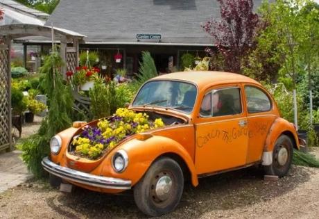 Orange Volkswagen Beetle Covered in Flowers