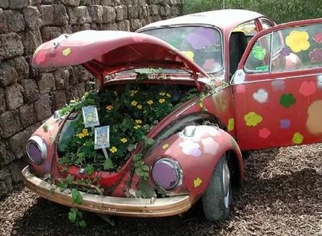 Pink Volkswagen Beetle Covered in Flowers
