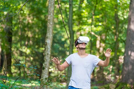 Man getting experience using VR-headset glasses of virtual reality