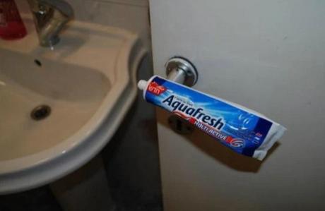 Old toothpaste tube used as a door handle