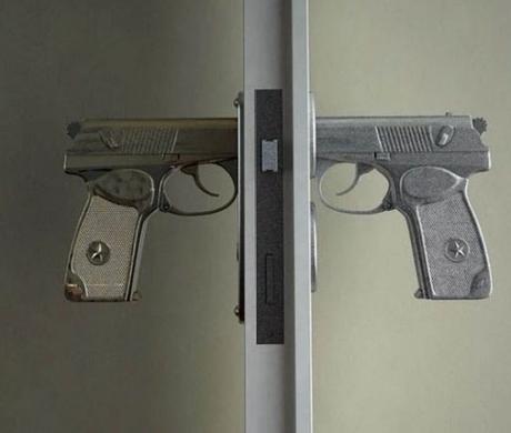 Gun inspired door handle