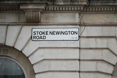 A sign reading 'STOKE NEWINGTON ROAD N.16'