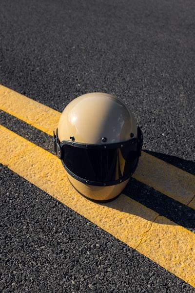 3 Powerful Meanings: What Does a Helmet Behind a Motorcycle Mean? 28 white helmet on gray concrete pavement