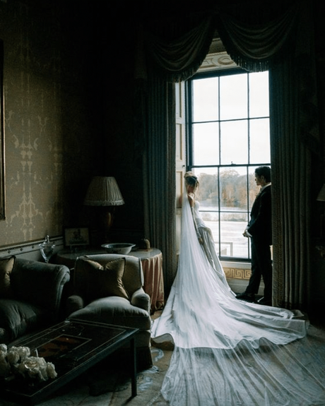 kate wasserbach and travis moore real wedding bride and groom standing near the window