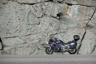 Introducing the Impressive Lineup of Yamaha Touring Motorcycles for 2024 1 gray sportbike park near stone wall