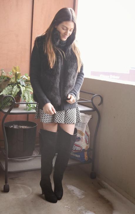 black fur vest, aqua black and white skirt, knee high boots