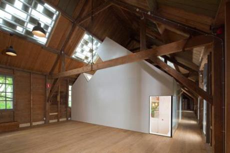 Corian-clad gallery into old timber armoury by Bureau SLA