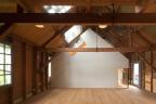 Corian-clad gallery into old timber armoury by Bureau SLA