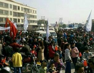 Thousands of local residents opposed to the waste incinerator power plant protest outside Jinzao township government offices in Shantou, Guangdong, Jan. 25, 2014.