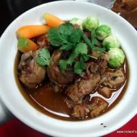 Spicy chicken stew with baby carrots and Brussels sprout