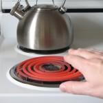 Hand approaches hot burner