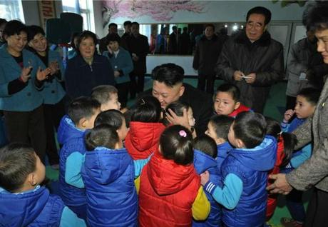 Kim Jong Un greets children at a Pyongyang orphanage and baby home (Photo: Rodong Sinmun).