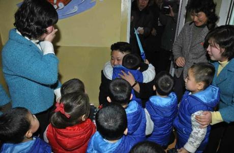 Kim Jong Un hugs a child during a visit to a Pyongyang orphanage and baby home (Photo: Rodong Sinmun).