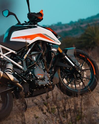 Discover the Top Naked Motorcycles for Sale and 3 Reasons to Make a Purchase 1 white orange and black sports bike
