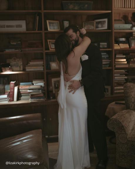 documentary style wedding photography brides hugging in the library