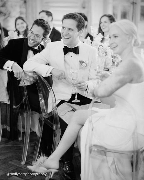 documentary style wedding photography guests at the wedding sitting at the table and smiling