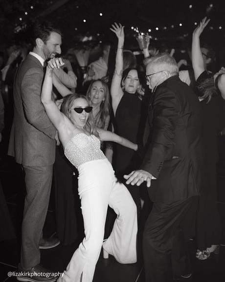 documentary style wedding photography bride dancing with dad on the dance floor under the soffits