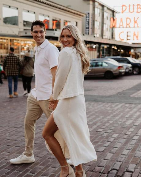 36 questions that lead to love man and woman holding hands and walking across the road