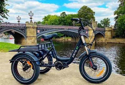 Introducing the Alluring Features and Upgrades of Indian Motorcycle Trike 2024 Models 2 black and gray bicycle near brown concrete bridge during daytime