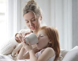 girl kid drinking milk with complan