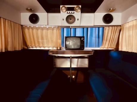 Interior of Camper with Obsolete TV and Speakers. depicting how the interior design is often a matter of choice. how to remove an RV valance will demonstrate how to personalize your RV space
