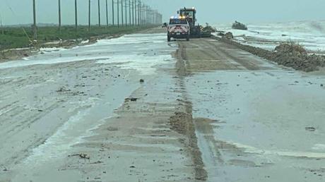 TxDOT crews removing debris and sand from the Bolivar Peninsula following flooding