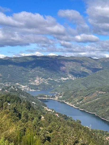 Lush green valley in Peneda-Geres National Park with a lake at the bottom