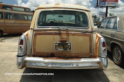 An abandoned 1953 Mercury Monterey woodie wagon, station wagon, in Orlando, Florida.