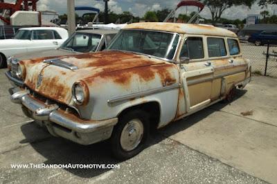 An abandoned 1953 Mercury Monterey woodie wagon, station wagon, in Orlando, Florida.