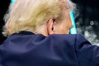 New images of Donald Trump without a bandage on his injured ear, show no signs of damage, as new evidence raises more questions than it answers about apparent assassination attempt in rural Pennsylvania