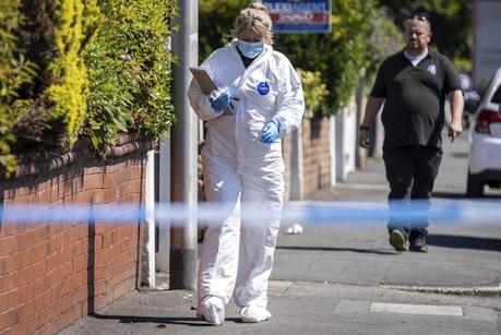 A police scenes of crime officer (SOCO) works at the scene in Southport, Merseyside, where a man has been detained and a knife has been seized after a number of people were injured in a reported stabbing on Monday.